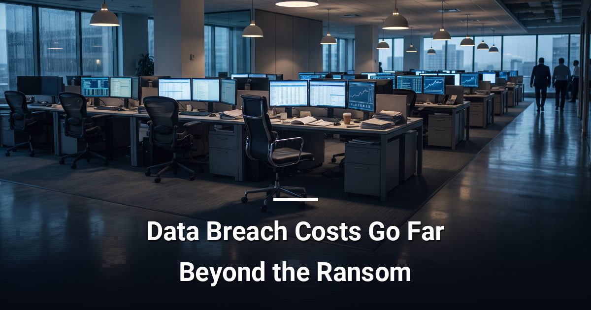 Empty office workstation at dusk with financial dashboards on screens, suggesting operational disruption from a data breach