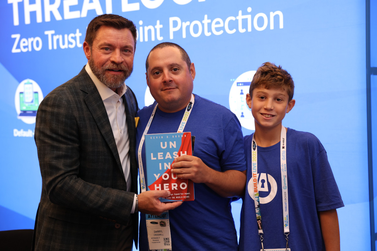 Our CEO Darryl Cresswell and his son pose for a picture with Keynote Speaker Kevin Brown